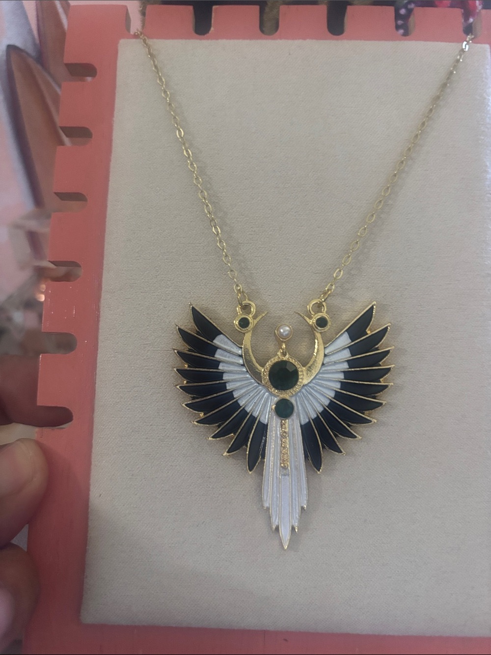 Gold-tone Black and White Winged Pendant Necklace with Green Accents